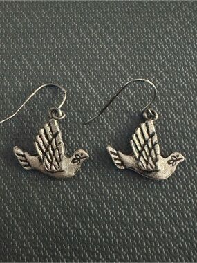 Silver -tone peace dove dangle earrings not stamped. Untested.